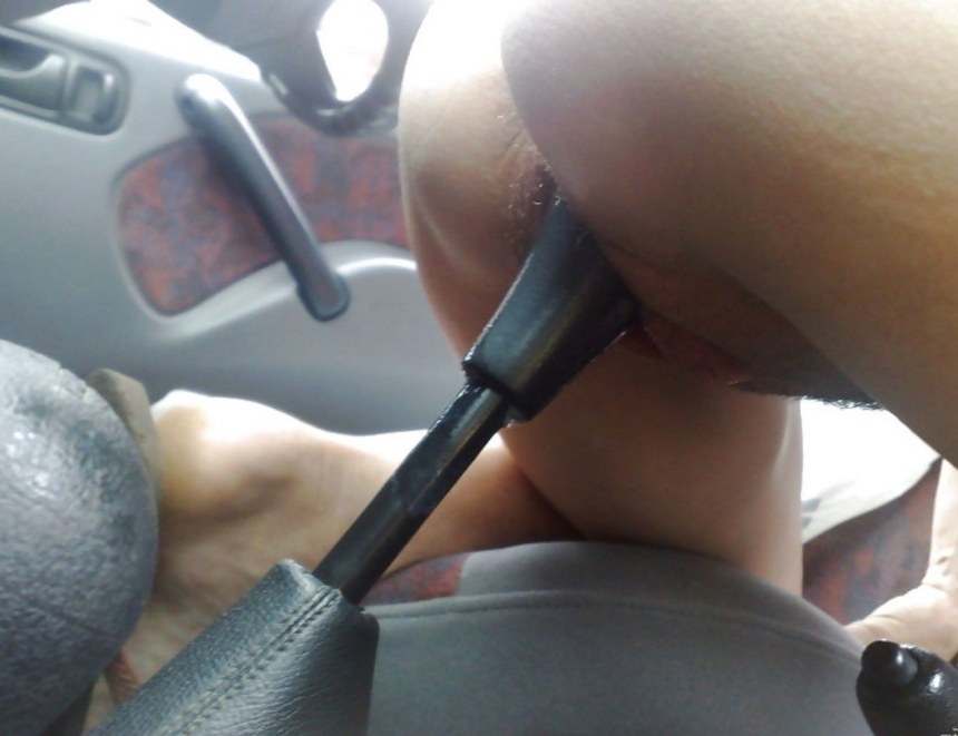 She sits on the Gear Shift with her pussy гиф